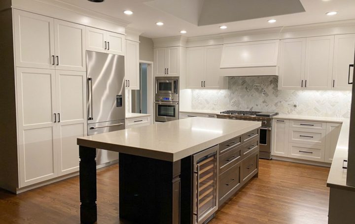 A spacious kitchen featuring a central island for food preparation and stainless steel appliances for a sleek look.